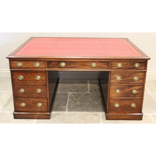 682 - A late 19th century mahogany partners desk, the rectangular moulded top inset with a gilt tooled red... 