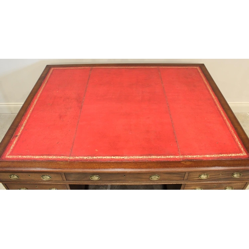 682 - A late 19th century mahogany partners desk, the rectangular moulded top inset with a gilt tooled red... 