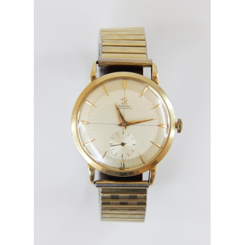 85 - A Gentleman's vintage Omega Automatic 14ct gold wristwatch, the round champagne dial with tapered ba... 