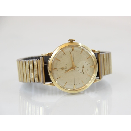 85 - A Gentleman's vintage Omega Automatic 14ct gold wristwatch, the round champagne dial with tapered ba... 