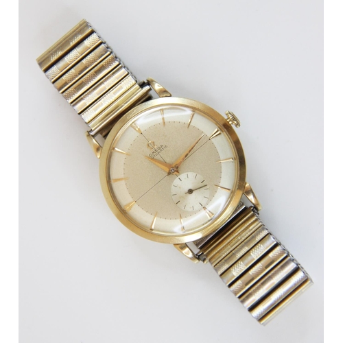 85 - A Gentleman's vintage Omega Automatic 14ct gold wristwatch, the round champagne dial with tapered ba... 