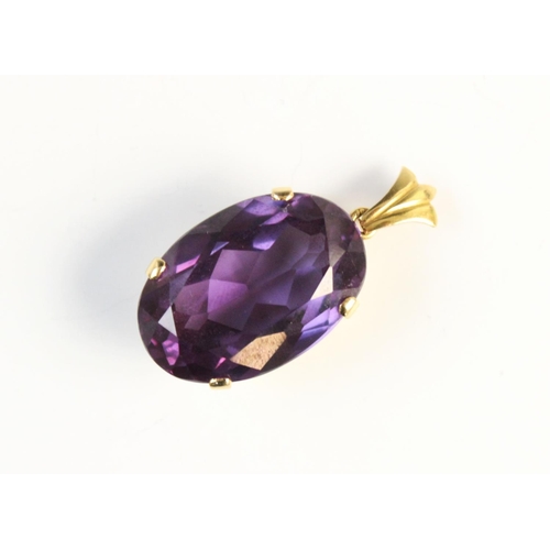 86 - A synthetic sapphire pendant, the oval mixed cut synthetic 'colour-change' sapphire (measuring 25mm ... 