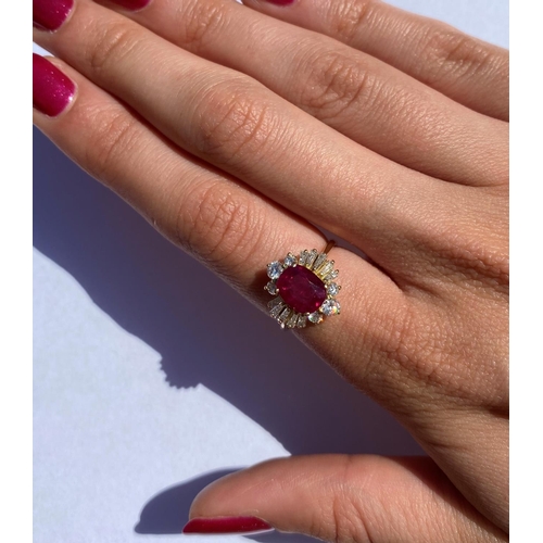 166 - A ruby and diamond cluster ring, the central rectangular cushion cut ruby (measuring 8.2 x 6.6 x 4.0... 