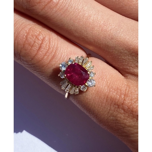 166 - A ruby and diamond cluster ring, the central rectangular cushion cut ruby (measuring 8.2 x 6.6 x 4.0... 