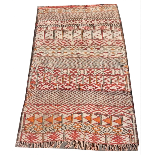 387A - A Berber tribe, North African, Moroccan wool carpet, with geometric bands in red, black and white co... 