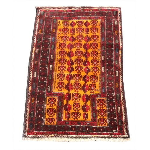 397 - A hand woven full pile Afghan Baluchi Nomadic prayer rug, with an orange ground, 128cm x 81cm