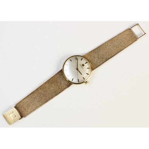 84 - A Gentleman's vintage 9ct gold Tissot wristwatch, the circular silver dial with baton markers, set t... 