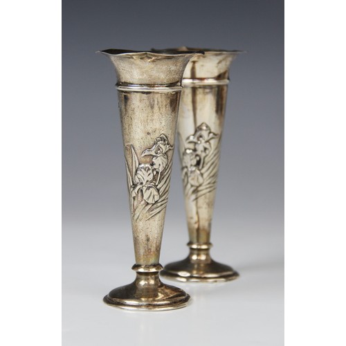 66A - A pair of Art Nouveau silver posy vases by William Comyns, London 1907, each of tapering form with f... 