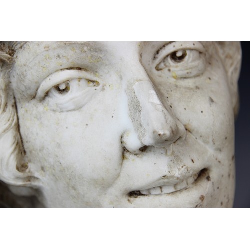 347 - An Art Deco marble sculpture of a female head, early 20th century, set above a grey marble plinth, 4... 