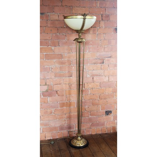 372 - An Art Deco style brass floor standing uplighter, late 20th century, the yellow moulded bowl set to ... 