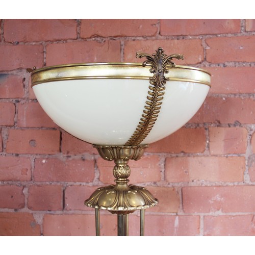 372 - An Art Deco style brass floor standing uplighter, late 20th century, the yellow moulded bowl set to ... 