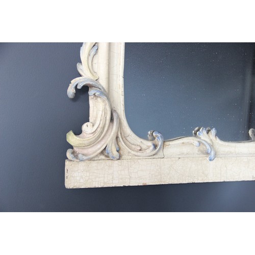 568 - A 19th century Florentine painted and scroll framed over mantel mirror with polychrome highlights, 7... 