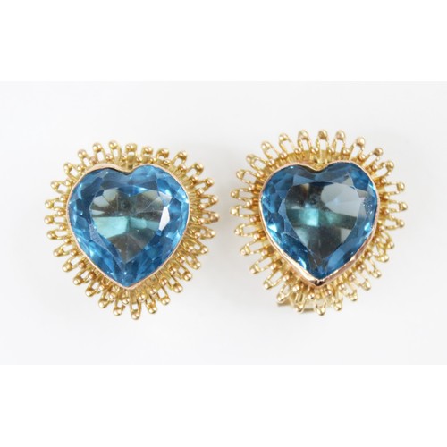 125A - A pair of spinel set heart-shaped clip-on earrings, each comprising a central mixed cut heart-shaped... 