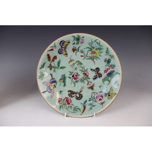 281 - A pair of Chinese porcelain celadon plates, 19th century, each decorated with flora and fauna, 26cm ... 