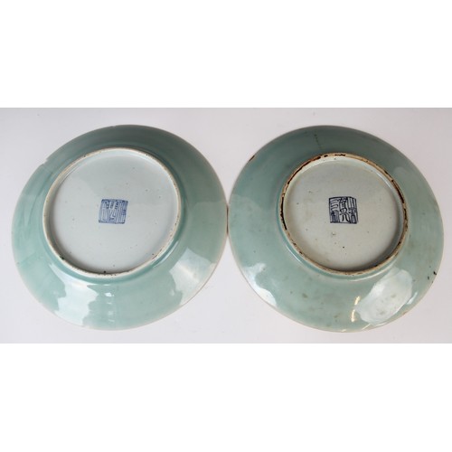 281 - A pair of Chinese porcelain celadon plates, 19th century, each decorated with flora and fauna, 26cm ... 