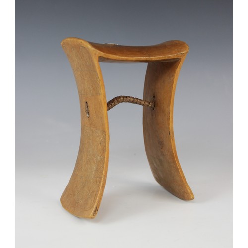 302 - An East African Ugandan Karamojong tribal headrest with native repair, 18.5cm high