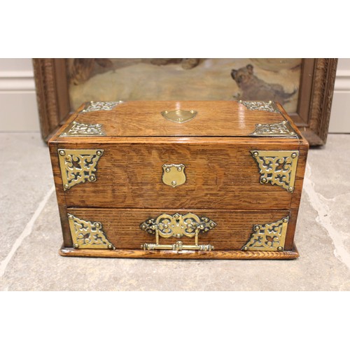 367 - A Victorian oak stationery box, applied with a brass shield shaped cartouche, openwork spandrels and... 