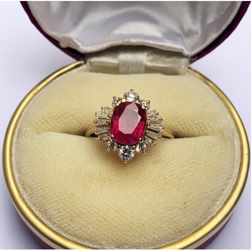 166 - A ruby and diamond cluster ring, the central rectangular cushion cut ruby (measuring 8.2 x 6.6 x 4.0... 