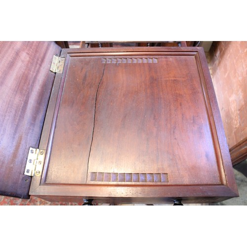 640 - A George III mahogany pedestal quartet music stand, in the manner of Gillows, the rectangular adjust... 