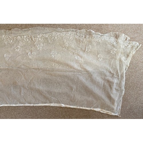 404 - An early 19th century Ayrshire work bodice, the unusual bodice with lace edged lobed bustle and foli... 