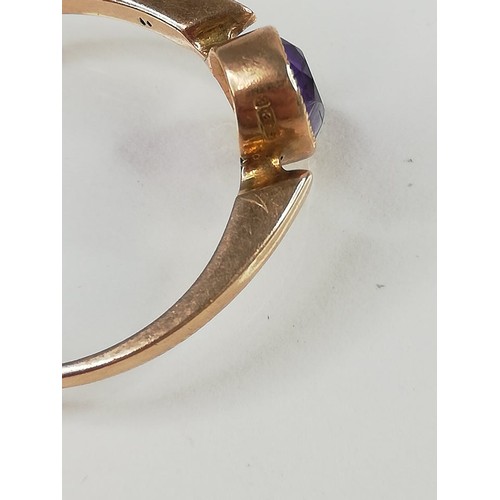 162 - A late Edwardian amethyst set 9ct gold ring, the central oval mixed cut amethyst (measuring 6.5mm x ... 