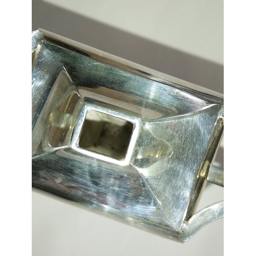 62 - A George V silver table lighter by Charles Boyton & Son Ltd, London 1912, of faceted form on tapered... 