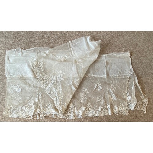 405 - A collection of 19th century and later white and blonde lace shawls, with floral and foliate decorat... 