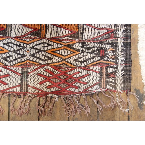 387A - A Berber tribe, North African, Moroccan wool carpet, with geometric bands in red, black and white co... 