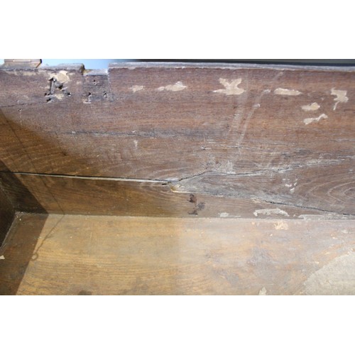 608 - An early eighteenth century oak six plank coffer, the rectangular moulded top opening to an integrat... 