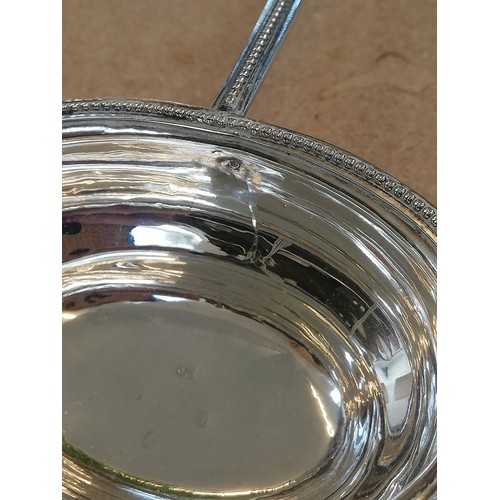 26 - A George III silver toddy ladle, date letter for 1786 (maker's mark and city mark worn) the oval bow... 