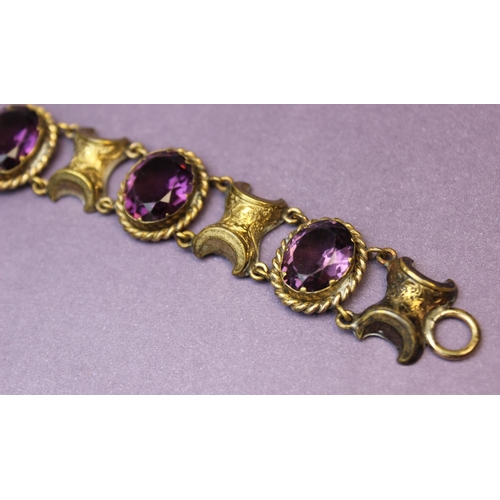 101 - A Victorian style paste set bracelet, comprising four oval mixed cut purple paste, each measuring 16... 