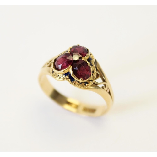 106 - A Victorian garnet and enamel 18ct gold ring, the trefoil shaped head set with three oval old cut ga... 