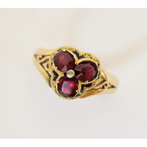 106 - A Victorian garnet and enamel 18ct gold ring, the trefoil shaped head set with three oval old cut ga... 