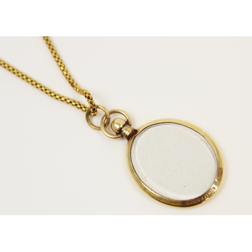 120 - An early 20th century yellow metal box-link chain, with spring ring and loop fastening, applied pad ... 