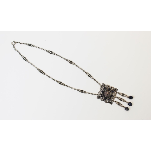 121 - An Arts & Crafts silver necklace attributed to Gustav Hauber, comprising a central polished jasper c... 