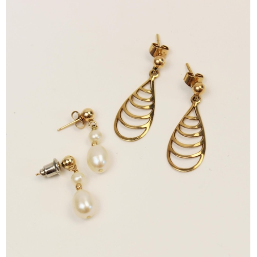 124 - A pair of 9ct gold cultured pearl set drop earrings, each designed as a yellow gold stud suspending ... 