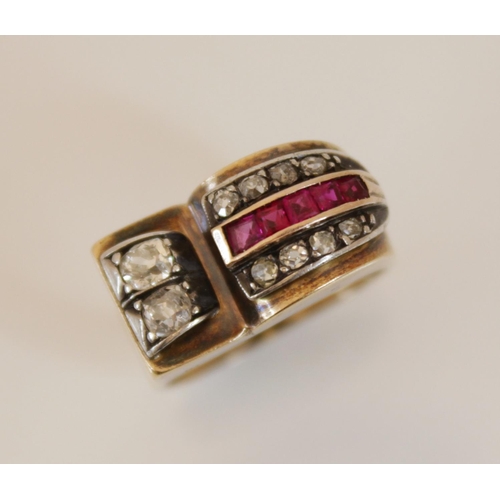 151 - An Art Deco 'Odeonesque' diamond and ruby ring, the stylized head designed as a tapering arch set wi... 