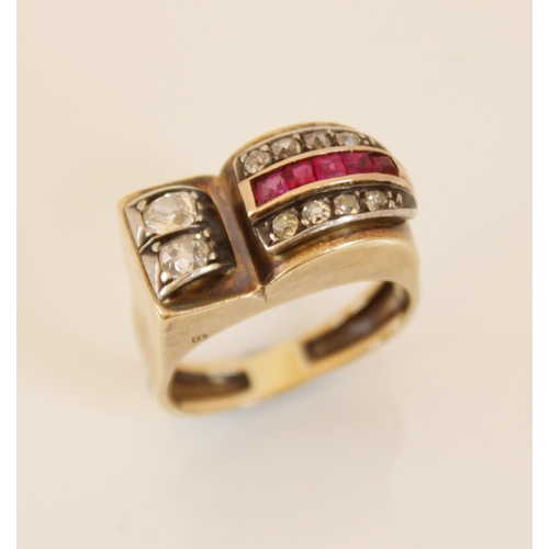 151 - An Art Deco 'Odeonesque' diamond and ruby ring, the stylized head designed as a tapering arch set wi... 