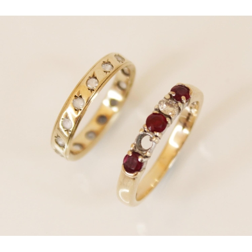 162 - A ruby and diamond 9ct gold ring, comprising three round mixed cut rubies and a round brilliant cut ... 