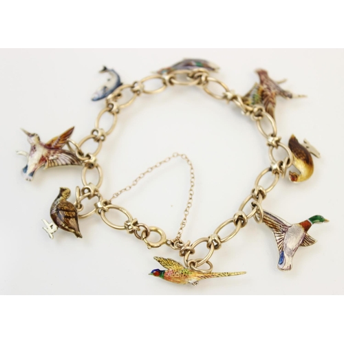 170 - A 9ct gold enamelled charm bracelet by Cropp & Farr, Birmingham 1953, the oval link chain with sprin... 