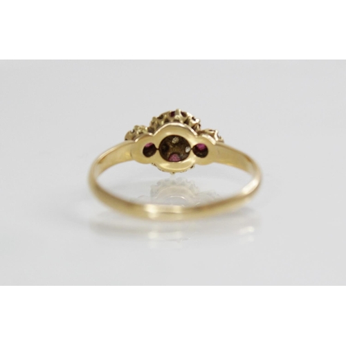 195 - An Edwardian ruby and diamond 18ct gold ring, the quatrefoil head set with four untested round mixed... 