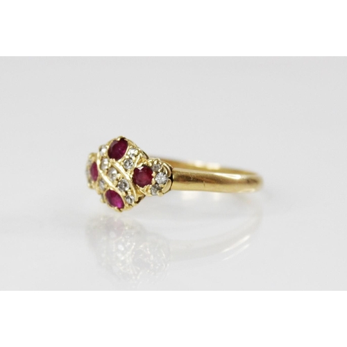 195 - An Edwardian ruby and diamond 18ct gold ring, the quatrefoil head set with four untested round mixed... 