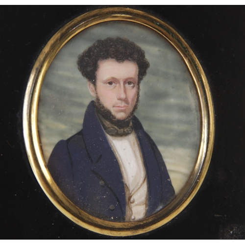 215 - English School (19th century), 
Half length portrait miniature of a gentlemen in a blue overcoat, 
8... 