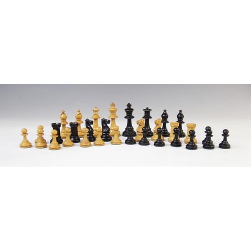 221 - A German Schachklub chess set, early 20th century, of typical form with boxwood and ebony pieces, in... 