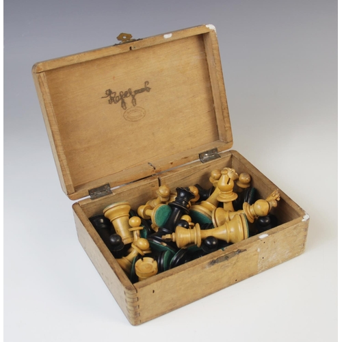 221 - A German Schachklub chess set, early 20th century, of typical form with boxwood and ebony pieces, in... 