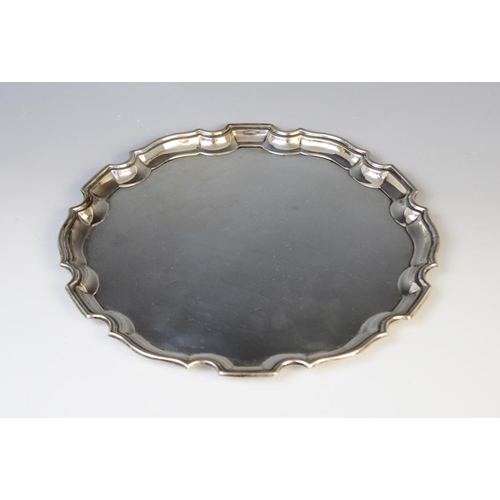 24 - A George VI silver salver by Deakin & Francis, Birmingham 1941, of plain polished circular form with... 
