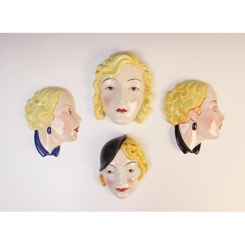 502 - Four Art Deco wall masks by Cope & Co, two modelled as a young lady in profile, and two as a young l... 