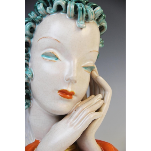 503 - An Art Deco Goldscheider wall mask, early 20th century, modelled as a lady with blue curled hair and... 