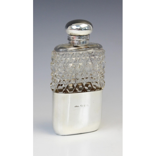 58 - A Victorian cut glass silver mounted hip flask by George Edwin Walton, Birmingham 1896, of rounded r... 