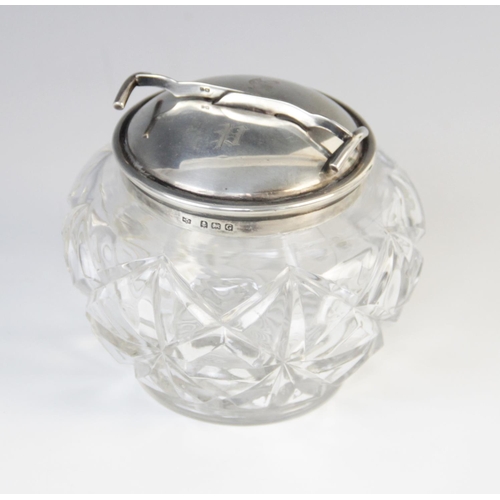 6 - A George V cut glass sugar bowl and silver cover, marks for W. Coulthard Ltd, Birmingham 1931, the c... 